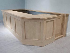 Solid oak bar handcrafted and ready for finishing. Built from scratch with detailed panel work and a smooth flowing corner design, ready to be prepped and sprayed to a flawless finish. From raw timber to a luxury centrepiece.