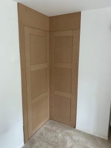 Bespoke fitted corner wardrobe completed by the Creative Finish Carpentry team