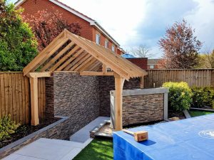A bespoke outdoor kitchen timber roofing