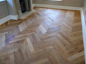 Solid oak herringbone installation. Perfect alignment. Flawless detail. Luxury flooring, built to last. Coventry & Warwickshire.