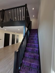 This full internal package was finished in Dulux Diamond Semi Gloss, giving a durable, wipeable surface ideal for high-traffic living. Crisp black woodwork paired with neutral walls keeps the space modern, bold, and consistent from floor to mezzanine.