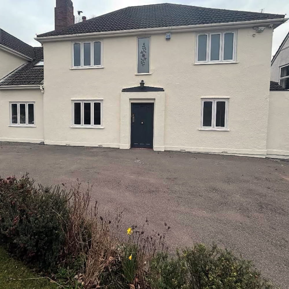 The front of a house that has been painted white